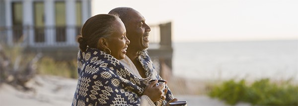 couple on beach post-retirement