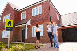 photo of young family buying a house