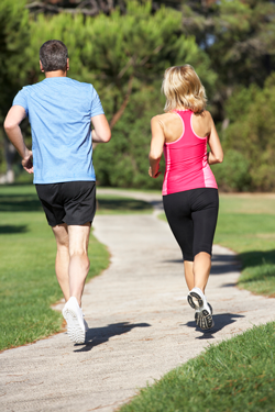 senior couple jogging financial review on-track