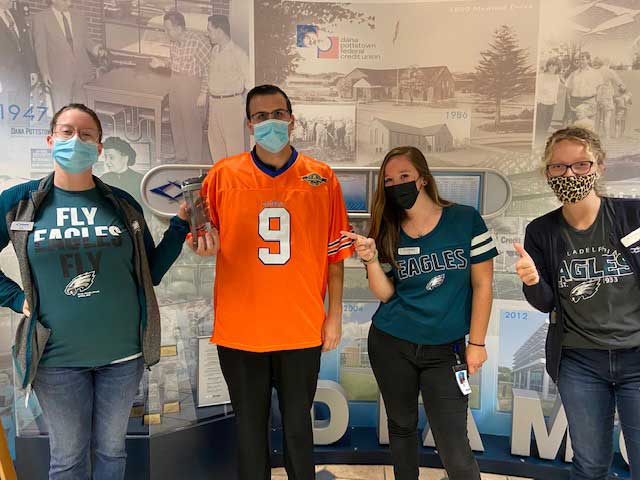 Diamond employees wearing Eagles attire to celebrate the first day of the NFL season.
