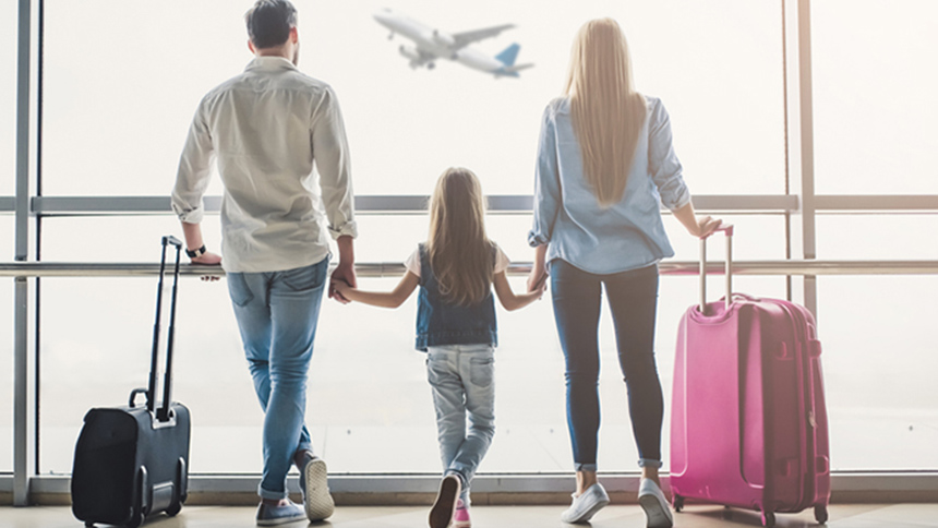 A family at an airport avoiding travel scams.