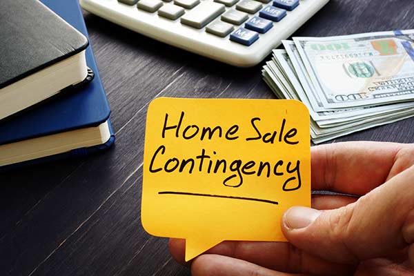 A sticky note that says "Home Sale Contingency."