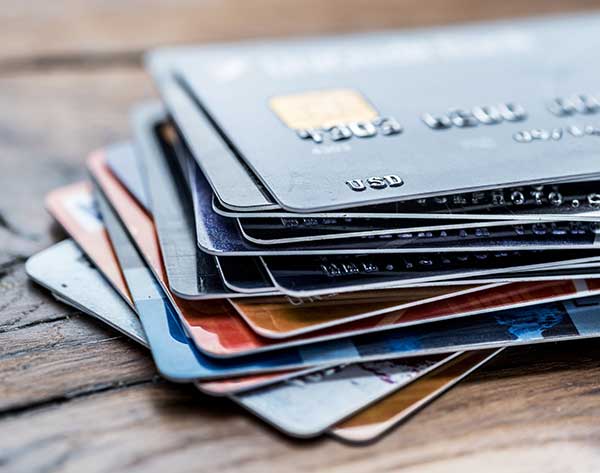 Credit Cards stacked on top of each other haphazardly.