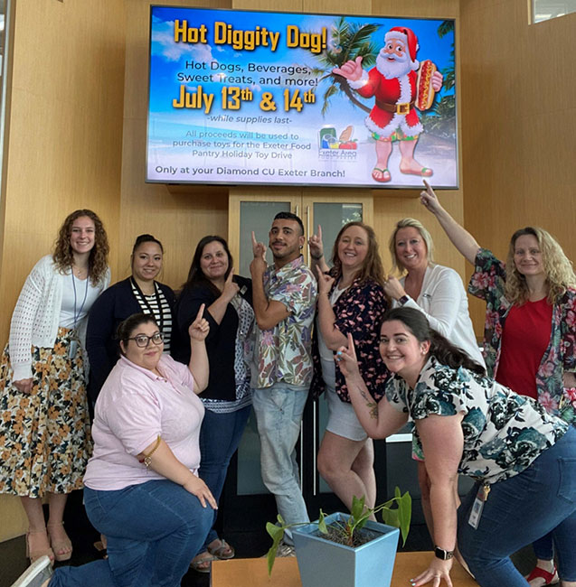 The Exeter branch team on Hot Dog Day, where they collected donations to benefit Exeter Food Pantry's Holiday Toy Drive.