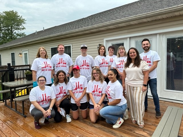 Diamond Credit Union volunteers at the United Way's Day of Caring after cleaning up a house for Hannah's Hope Ministries.