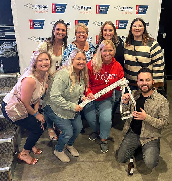 Diamond Credit Union team with tickets. They raised $5,200 for Relay For Life through the 2023 All in for Hope casino event.