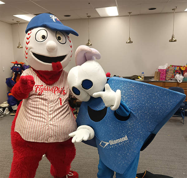 The Diamond Credit Union mascot poses with the Fightin' Phils mascot.