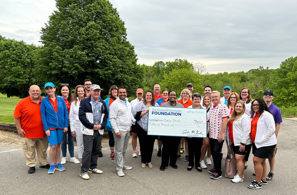 Diamond team presents a giant check for $56,000 to the American Cancer Society.