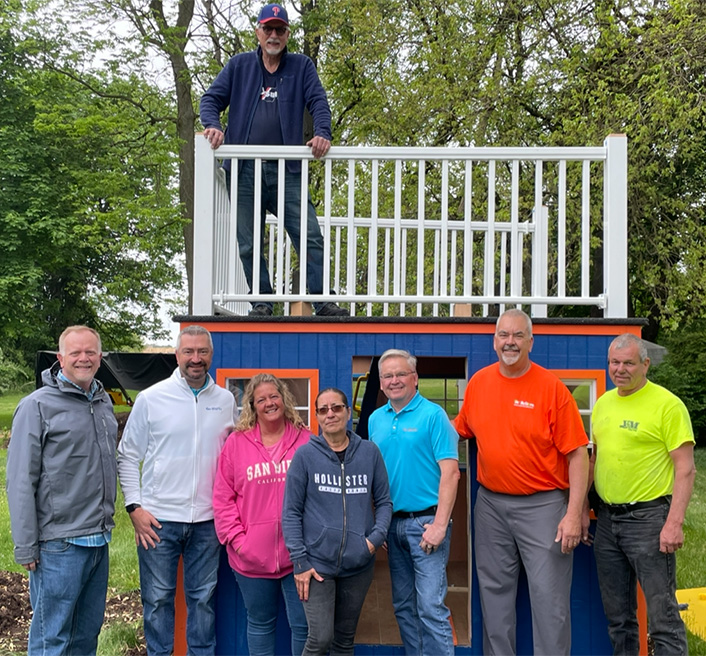Diamond Credit Union team donates $10,000 to Habitat for Humanity.