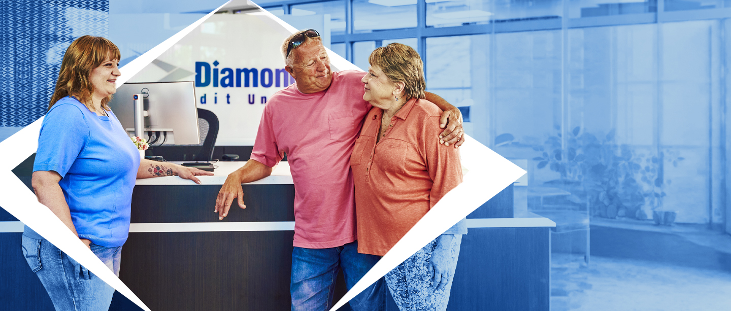 Home Diamond teammate greeting two members standing at the front desk.