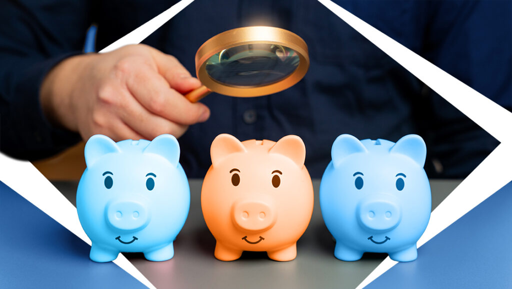 mans hand holding a magnifying glass directed toward 3 blue and orange piggy banks. Diamond design highlights the piggy banks. money market vs. high-yield savings vs. share certificate