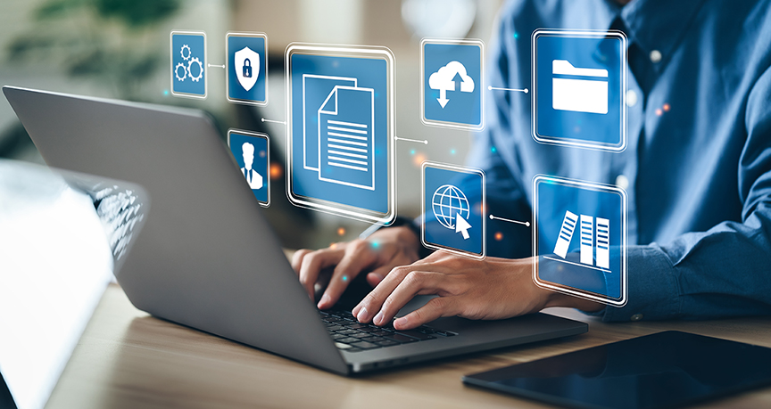 Holographic images above a man typing on a laptop, symboling online tools to help you run your business. 