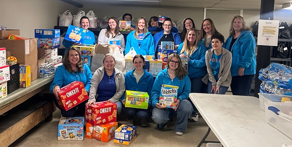 Volunteers from Diamond Credit Union's Pottstown, Royersford and Boyertown branches at Operation 143 to fill backpacks with the supplies they collected throughout January and February.