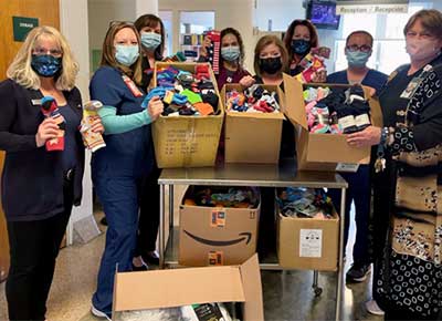 The sock drive led by Diamond's Tower Health Reading Hospital branch staff brought in 1,200 pairs of socks to help people in need.